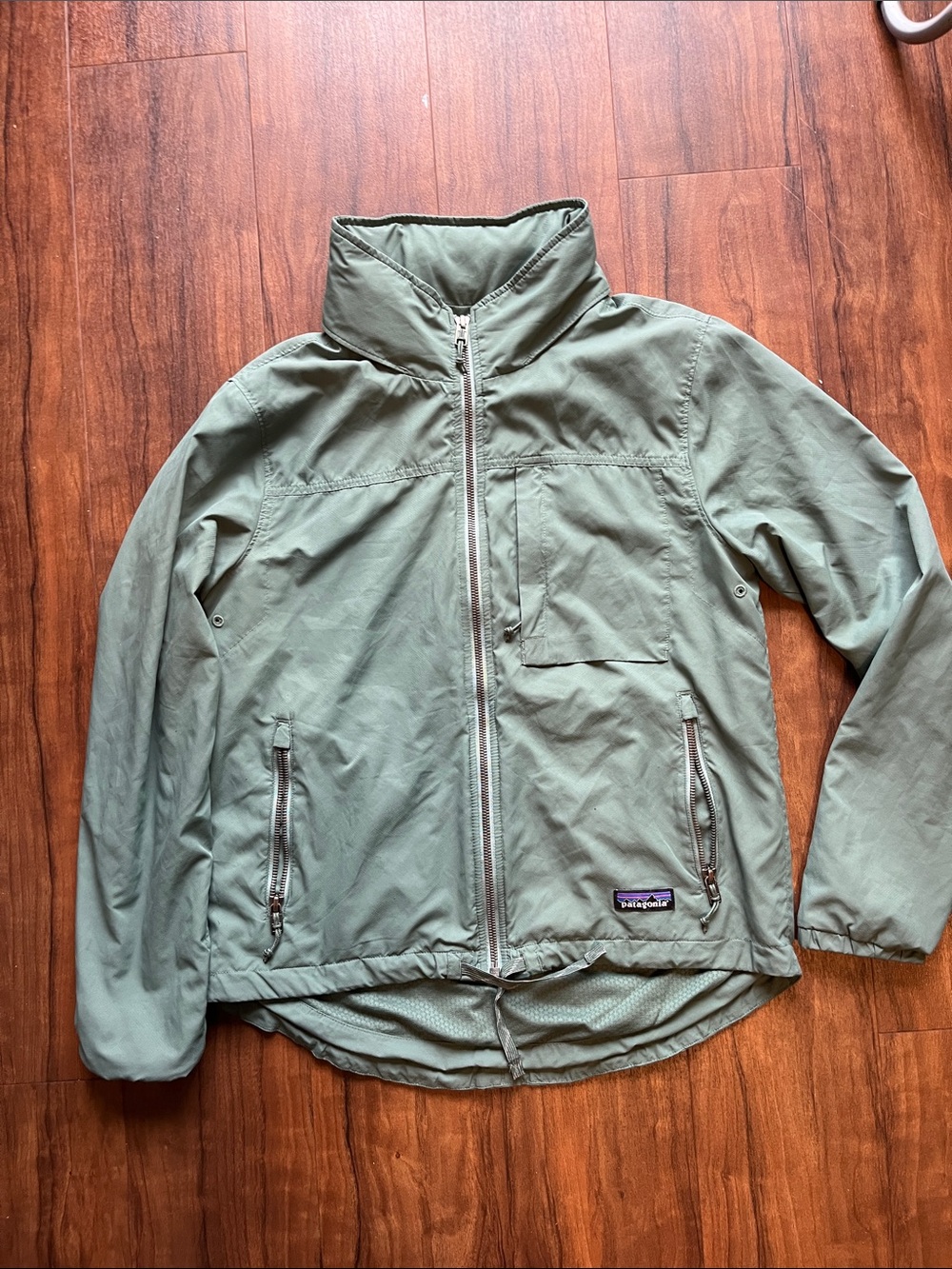 Patagonia women’s pesto Green Jacket with Full Zip built in hood (biking)